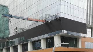 Video shows workers swinging in high winds in downtown Edmonton [upl. by Orianna]