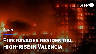 Fire ravages residential highrise in Spains Valencia  AFP [upl. by Lyris]