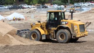 CAT 950M Loader moving dirt on a pile and driving [upl. by Malvie]