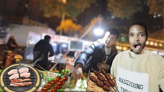 black man speaks chinese and eats street BBQ in chinese street food market [upl. by See]