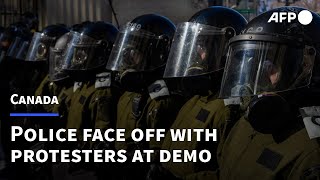 Protesters face off with police trying to clear trucker demo in Ottawa  AFP [upl. by Aihtekal]