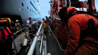 Torbay lifeboat assists sick passenger on board Queen Mary II [upl. by Anwahsiek]