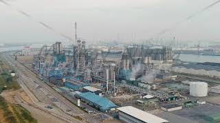 Dolly zoom Antwerp Belgium Port infrastructure with docks and factories Morning hours Aerial Vi [upl. by Oleta]