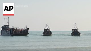 British soldiers piper mark 80th anniversary of DDay with reenactment on Normandy beach [upl. by Rawden]