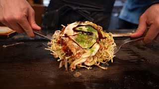 Eating Michelin Guide Okonomiyaki in Osaka Japan [upl. by Otrebilif]