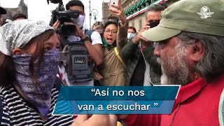 Hombre increpa a feminista durante marcha por los 43 de Ayotzinapa [upl. by Leunamme]