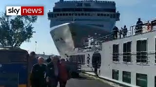 Cruise ship crashes into dock and tourist boat in Venice [upl. by Atteynek]