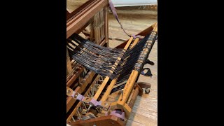 Warping a loom Back to front on Baby wolf loom using warping helpers [upl. by Saville422]