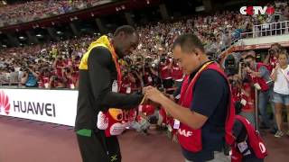 Usain Bolt Receives Gift from Cameraman Who Crashed into Him [upl. by Bala]