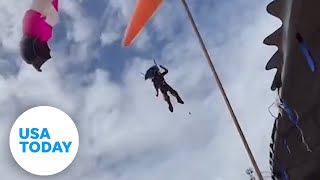 Paraglider loses control crashes through roof  USA TODAY [upl. by Warthman]