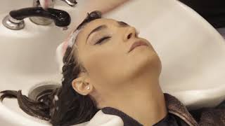 lovely woman backward shampoo trailer inside hair salon [upl. by Thistle778]