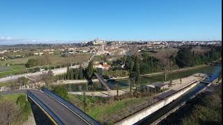 bridges over the canal du midi with beziers in background drone view [upl. by Yboc]