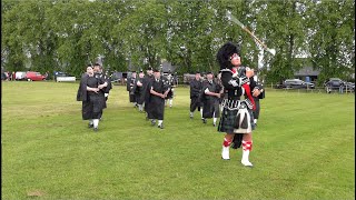 Mace flourish from Drum Major leading Kintore Pipe Band march during 2024 Oldmeldrum Highland Games [upl. by Eliott]