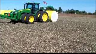 John Deere 8R with Laforge Front hitch moving cotton bales [upl. by Hoeg]