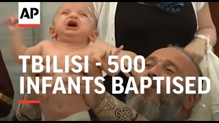 500 infants baptised in mass Orthodox ceremony [upl. by Glick]