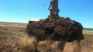 371Volvo excavator STOCKPILING dirt to build roadways up between irrigation fields of rice [upl. by Morey]