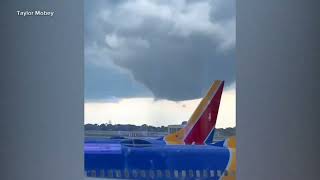 Tornado touches down near Chicagos OHare airport disrupting hundreds of flights [upl. by Nilats147]