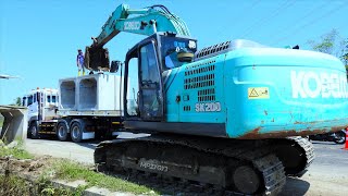 Kobelco Excavator Truck Unloading And Installing Precast Box On The Storm Drain Construction [upl. by Tony132]