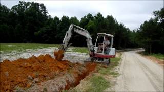 Trenching with the Mini Excavator [upl. by Llered]