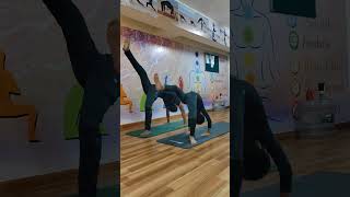 Standing chakrasana practice with student [upl. by Etnovert]