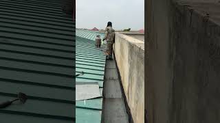 Building in Ghana  Bitumen membrane application as a waterproofing agent on a hidden roof roofing [upl. by Coyle]