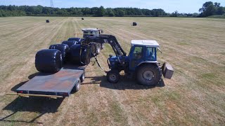 Loading hauling and stacking haylage bales [upl. by Anat]