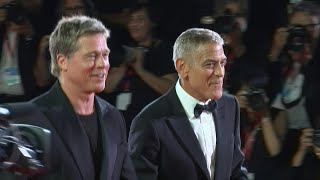 George Clooney et Brad Pitt foulent le tapis rouge à Venise  AFP [upl. by Milo]