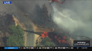 Helicopters extinguishing fire with water drops [upl. by Simone]