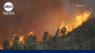 Thousands of buildings threatened by California wildfires as evacuations continue [upl. by Savihc240]