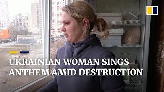 Ukrainian woman sings national anthem in bombedout Kyiv flat [upl. by Engleman]