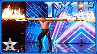 Strongman Tulga carries FLAMING pole by his TEETH  Unforgettable Audition  Britains Got Talent [upl. by Mokas]