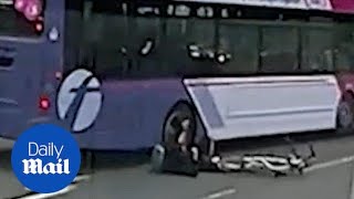 Cyclist inches from being crushed to death between car and bus [upl. by Verina744]