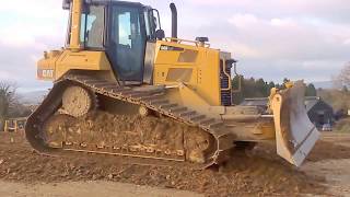 CAT D6 dozer at work pushing gravel for road construction part 1 [upl. by Saffren580]