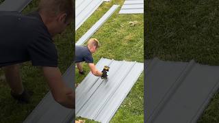 Crew installing Sea Slate Textured Premier Ribbed Metal on a newphilidelphia home [upl. by Notnil19]