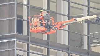 About 4K highrise building windows shattered in downtown from storms [upl. by Ulyram268]