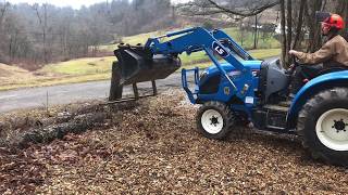 190 LS Tractor moving logs with pallet forks cutting and splitting firewood [upl. by Nadabus639]