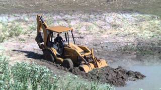 Backhoe Stuck In Mud [upl. by Aridaj]