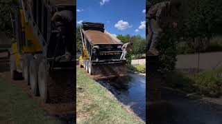 Nothing beats some brown pea gravel 🤩  🎥 southernsunpaving9979 asphaltpavement construction [upl. by Aicemat]