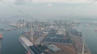 Antwerp Belgium Port infrastructure with docks and factories Wind power plants Morning hours St [upl. by Yanehs]