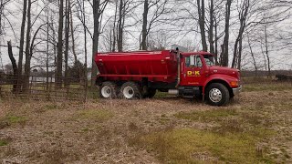 Spreading lime alongside Allis Chalmers tractor doing field work [upl. by Sinylg]