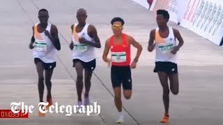 Runners appear to let Chinese contestant win Beijing halfmarathon [upl. by Nortna]