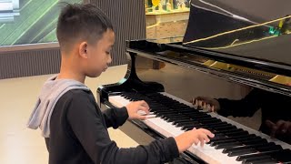 8 year old pianist plays RUSH E In public Hardest piano song in the world [upl. by Abla]