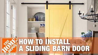 How to Install a Sliding Barn Door  The Home Depot [upl. by Zak457]