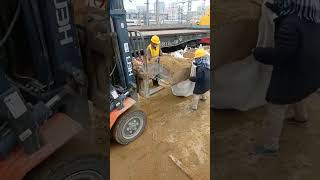 A forklift loads sand into a bag [upl. by Reitrac208]