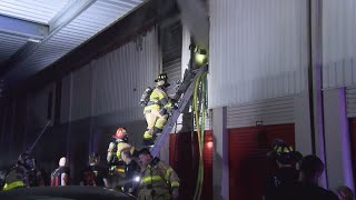 Firefighters battle 5alarm fire at selfstorage facility in Spring area [upl. by Dupaix]