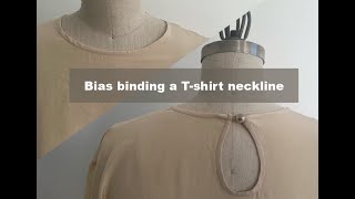 How to finish a neckline with bias binding [upl. by Nauqed]