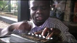 Bassy In Malawi  Blind man playing an instrument [upl. by Zampino]