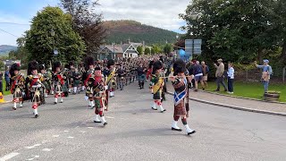 Massed Pipes and Drums marching to the 2023 Braemar Gathering Highland Games in Scotland [upl. by Particia]