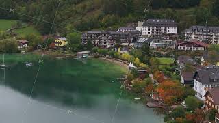 Aerial view of hotels on the shore of Fuschlsee in Fuschl am See Austria The water is a deep [upl. by Elahcar]