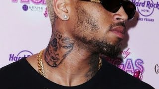 Chris Brown New Neck Tattoo of Rihanna Beaten Face [upl. by Oilicec864]